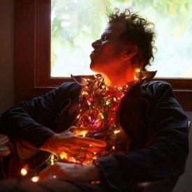 Tom Waits wearing Christmas lights Tom Waits wearing Christmas lights