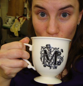 Cosette kicks it with a fancy mug of coffee Cosette kicks it with a fancy mug of coffee